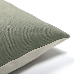 Upper corner of Griffin pillow showing texture green front and ivory backing.