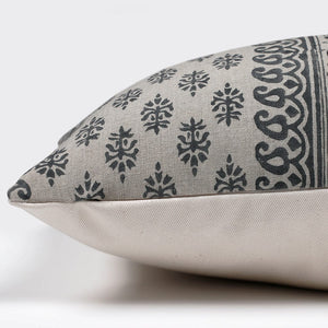 Side view of Jasmine lumbar pillow cover showing gray and blue front with ivory backing.