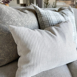 Laney lumbar, Bailey, and Fitz pillow on a grey sofa.