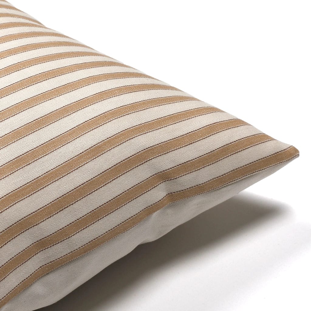 Corner of Leo pillow cover from Colin and Finn showing tan stripe details with ivory backing