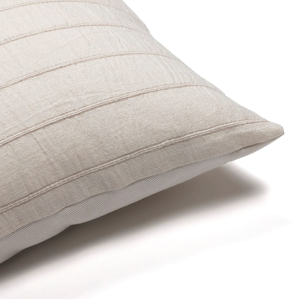 Upper corner of Logan lumbar pillow cover from Colin and Finn on a white backdrop.