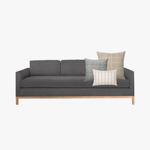Dark gray sofa with mock-up of Naples pillow combination from Colin and Finn.
