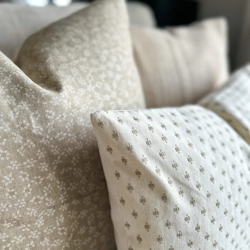 Close up of Elodie and Neville in Sand pillow covers from Colin and Finn showing the taupe embroidery details.