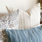 Close-up view of Penelope, River, and Oscar pillow covers from Colin and Finn.