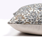 Side view of Penelope pillow cover from Colin and Finn showing blue, green, and brown floral print and solid ivory backing.