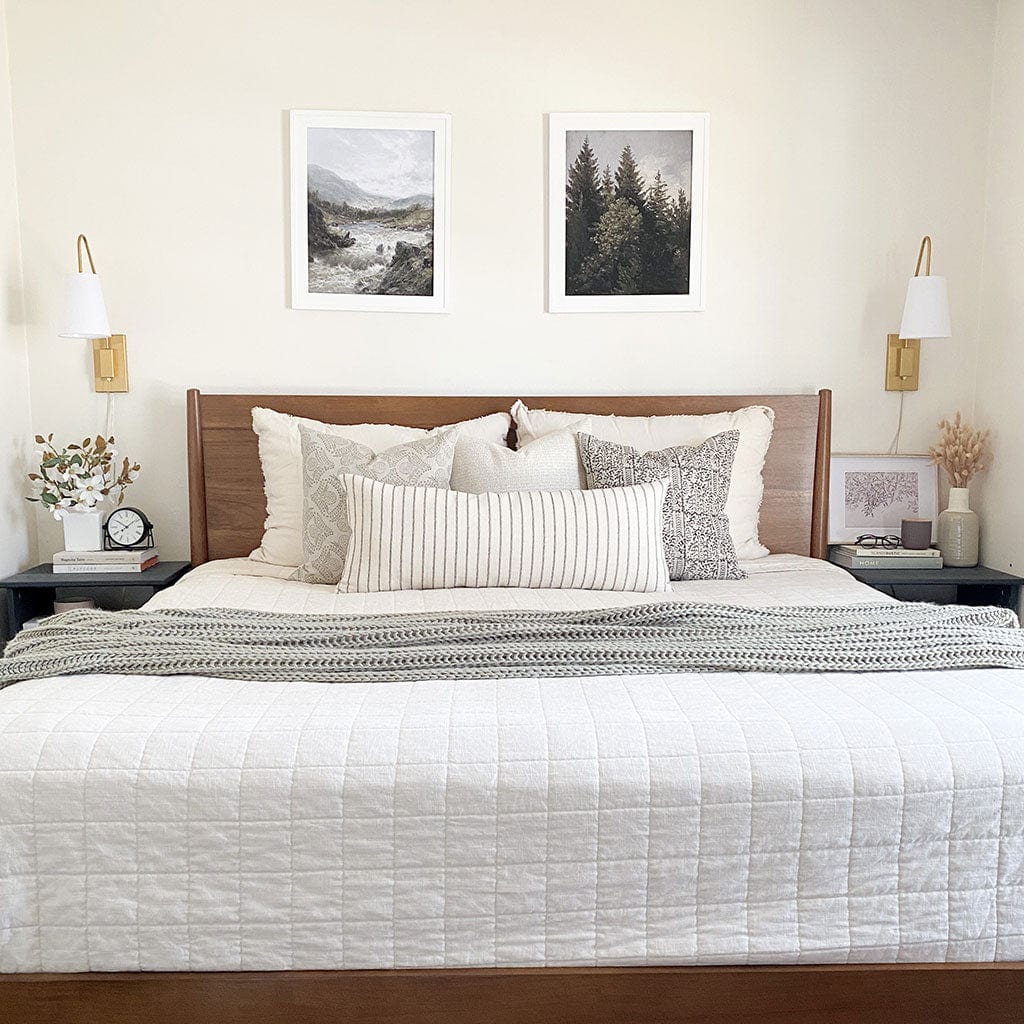 Petra pillow combination from Colin and Finn on a white bed.