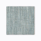 Quinn fabric swatch from Colin and Finn. A turquoise woven stripe on natural fabric