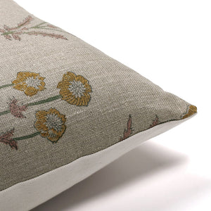 Upper corner of Remington pillow cover showing floral front and solid ivory back.