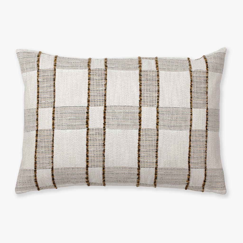 The Royce pillow cover from Colin and Finn. A plaid design with warm colors and fringe detailing