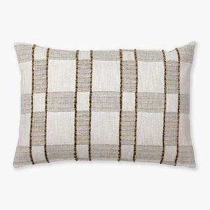 The Royce pillow cover from Colin and Finn. A plaid design with warm colors and fringe detailing