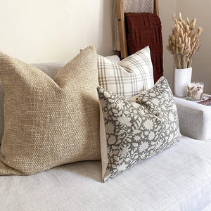Sawyer lumbar pillow cover on a white sofa with Colin and Finn's Bailey and Weston pillows.