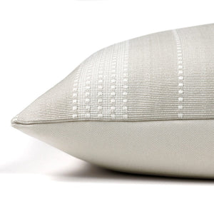 Side of the Sadie pillow cover showing the front fabric and the ivory cotton backing