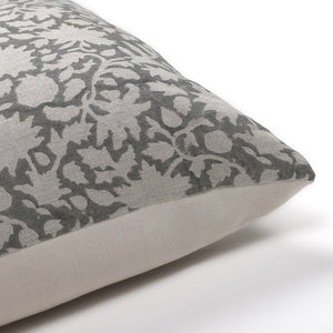 Upper corner of Sawyer in gray pillow cover from Colin and Finn. Gray linen with abstract natural linen floral pattern on top.