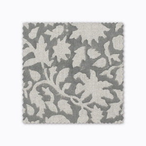 Sawyer fabric swatch from Colin and Finn. A gray floral hand-block textile on natural linen