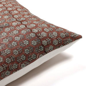 Corner of Serena pillow cover showing the red floral block print design