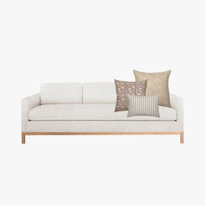 Spencer Combo from Colin and Finn on a mockup white sofa.