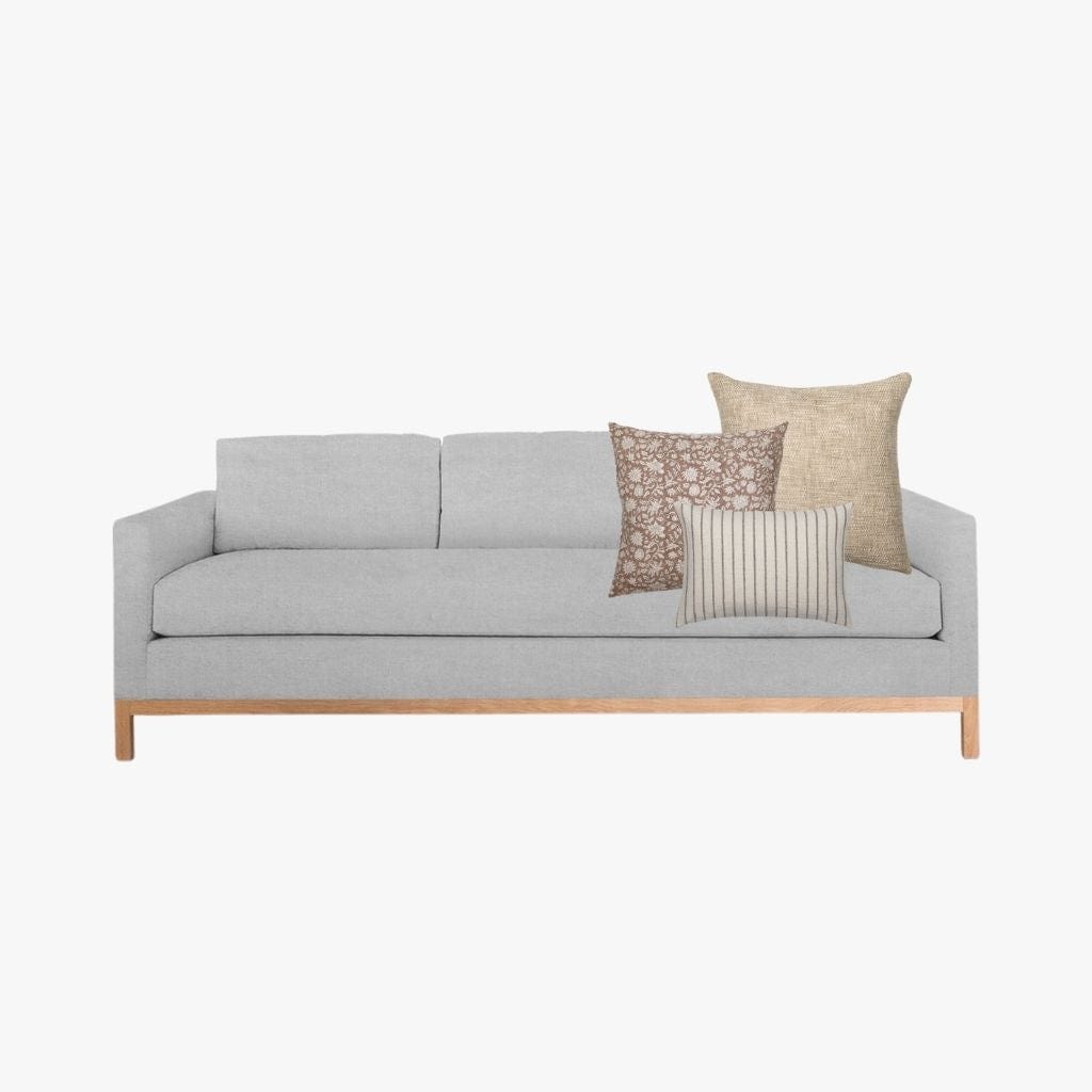 Mockup of Spencer Combo from Colin and Finn on light gray three-seat sofa