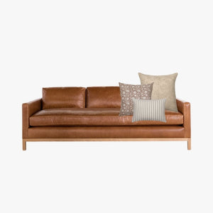 Cognac leather sofa mockup with Colin and Finn Spencer Combo.