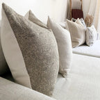 Closeup view of Fitz pillow cover with Walter pillow combination on a sofa.