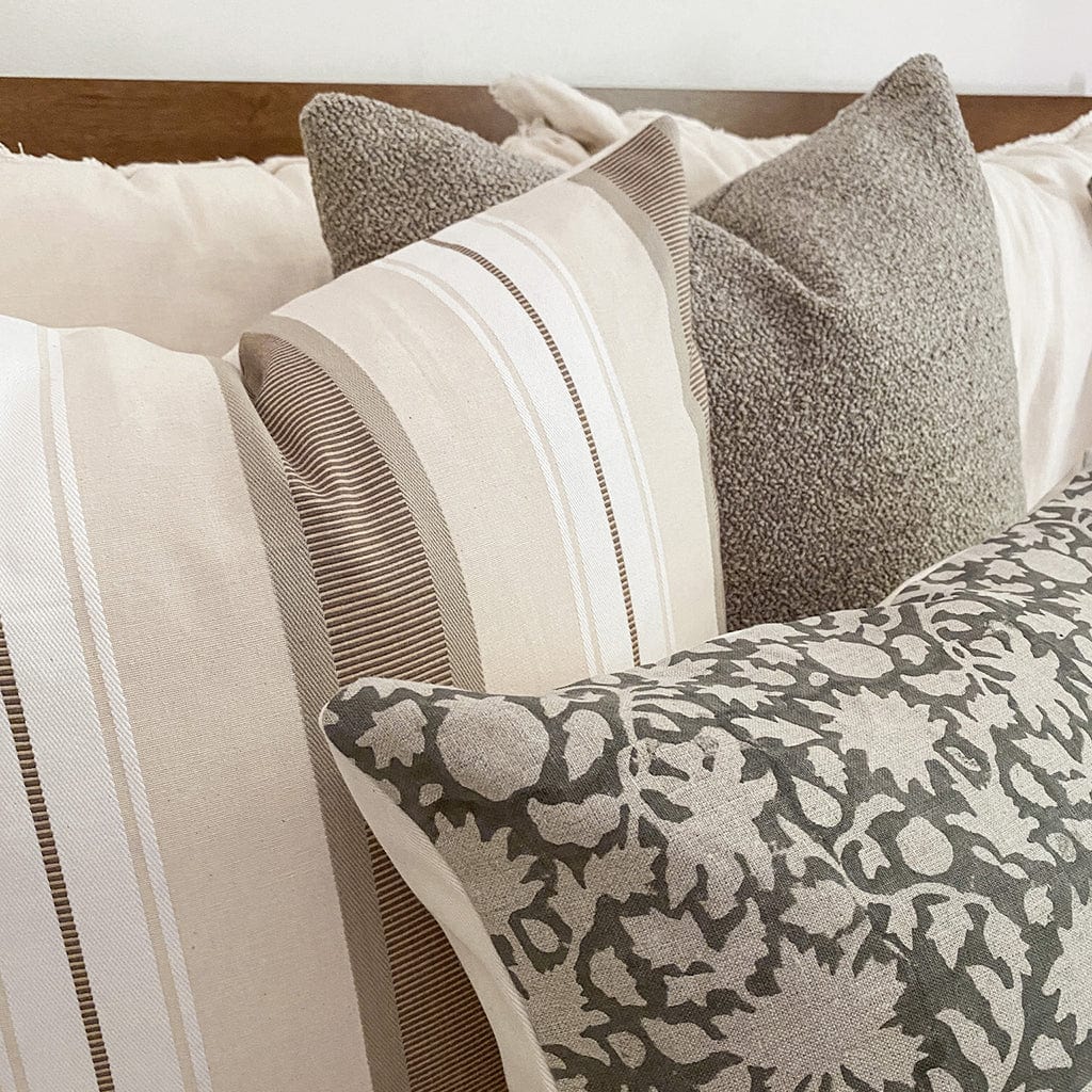 Closeup view of Waylon, Charles, and Sawyer showing the various textures of each pillow cover from Colin and Finn.