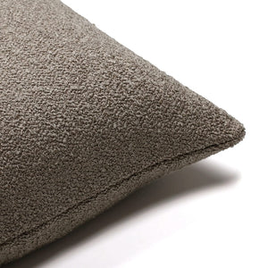Corner of the Waylon pillow cover to show the texture of the brown boucle material