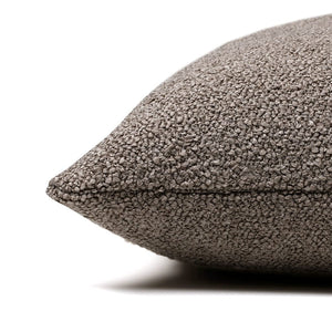Side of the Waylon pillow cover to show the texture of the brown boucle material on the front and back