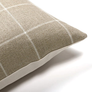 Upper corner of Wesley pillow cover showing taupe and white plaid on front and solid ivory backing.