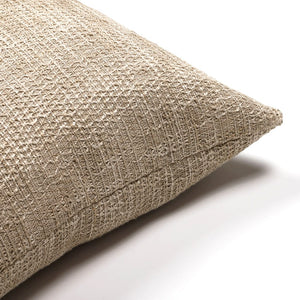 Corner view of Weston pillow cover showing brown and beige thread details. 