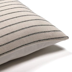 Corner of Winston pillow cover from Colin and Finn showing natural stripped front and ivory backing.