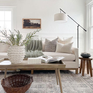 Rory, Madison, and Laney lumbar pillow cover from Colin and Finn on white sofa in modern European living room.