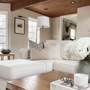 Sawyer pillow cover from Colin and Finn with Laney and Bardot burlap lumbar on white sofa.